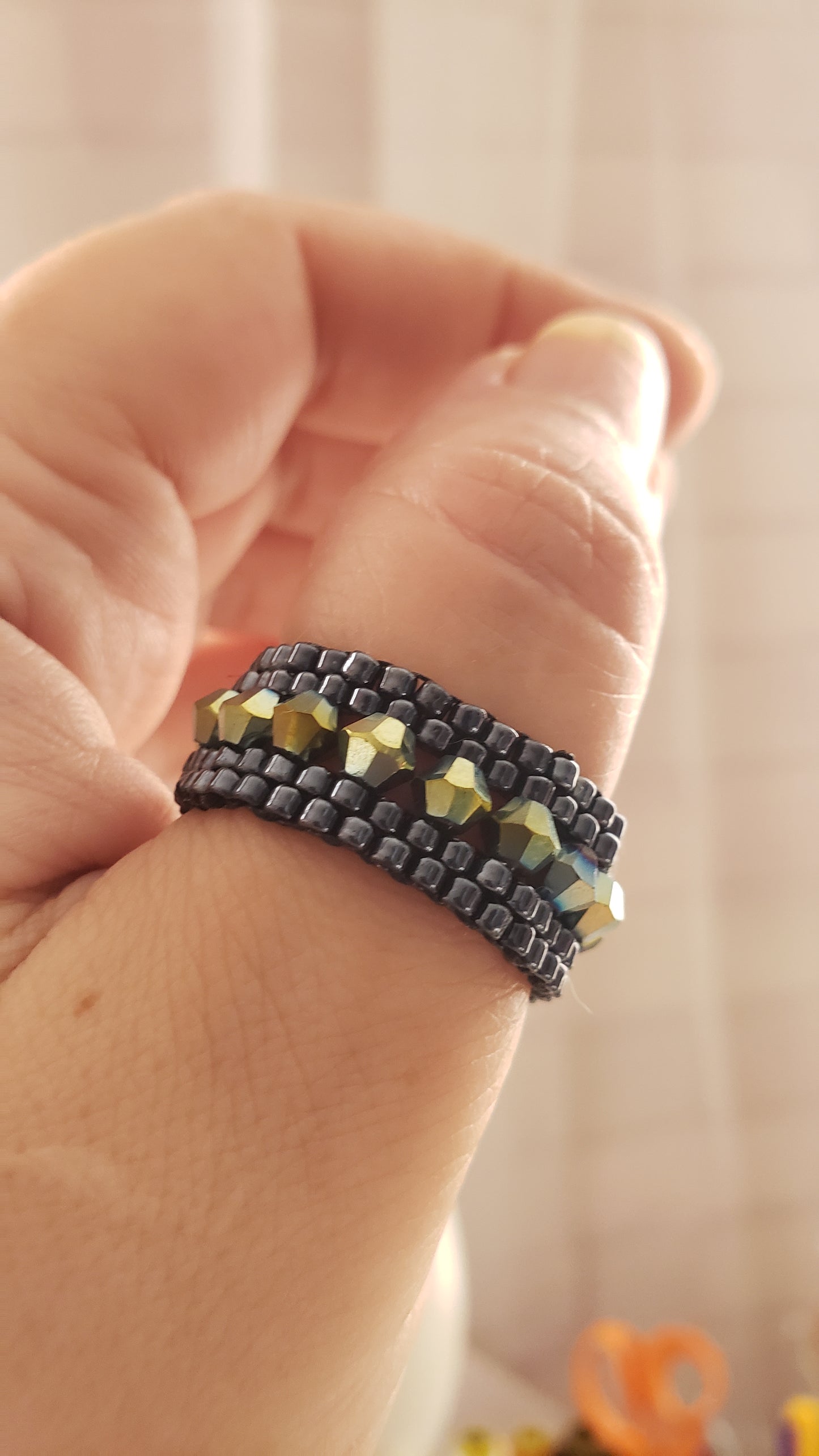 Metallic black beaded ring